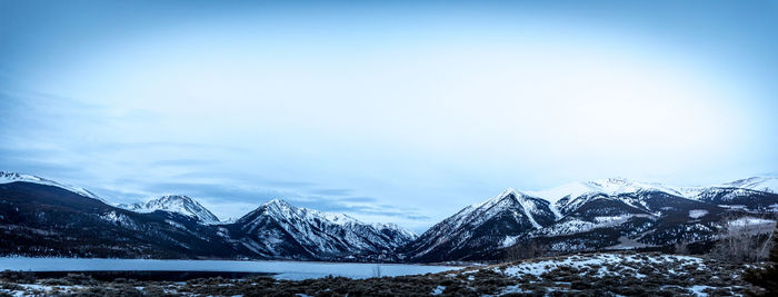 Scenic view of snowcapped mountains against sky