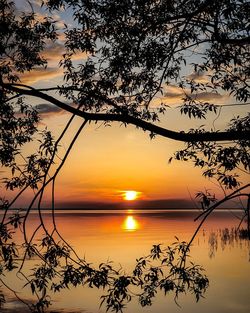 Scenic view of sea against romantic sky at sunset