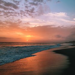 Scenic view of sea against sky at sunset