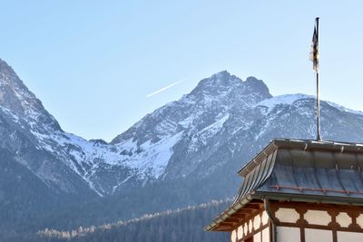 Scenic view of snowcapped mountains against clear sky