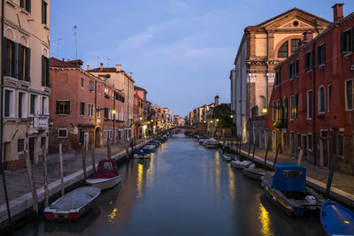 Boats moored in canal