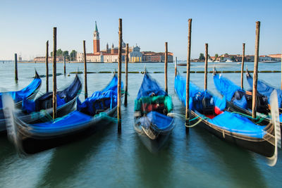 Boats moored in sea