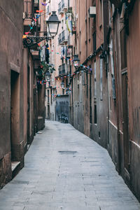 Alley amidst buildings in city