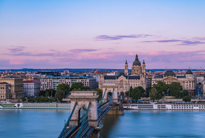 High angle view of chain bridge and city buildings