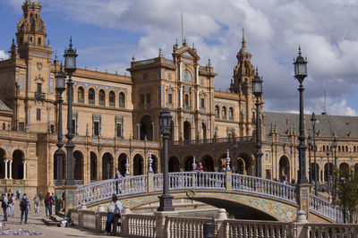 People walking in front of built structures