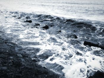 High angle view of rocky sea shore