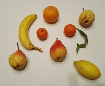 Close-up of fruits against white background