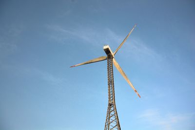 Low angle view of windmill against sky