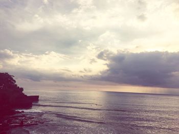 Scenic view of sea against sky at sunset