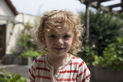 Portrait of cute smiling girl in lawn