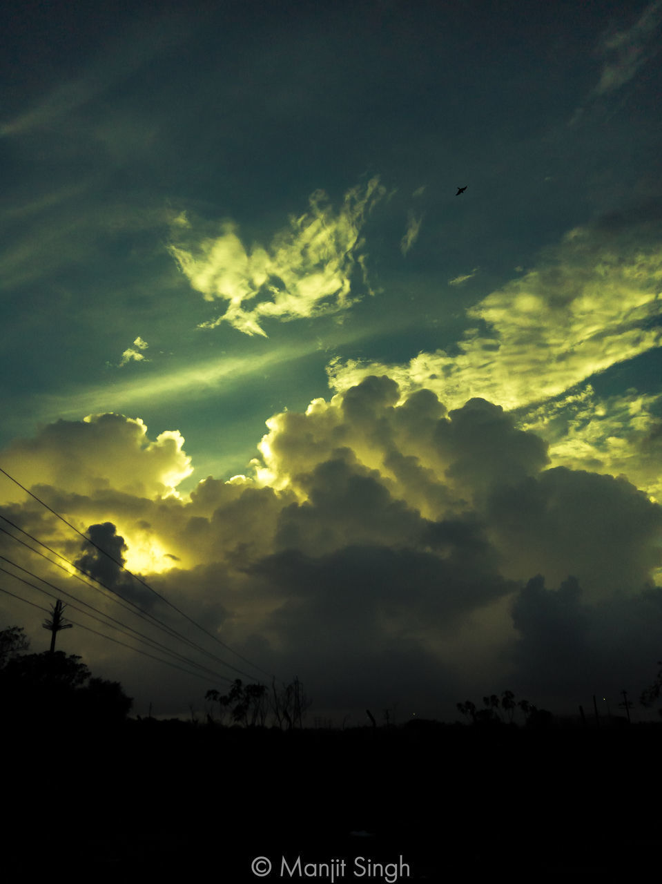 SCENIC VIEW OF SILHOUETTE FIELD AGAINST SKY AT SUNSET