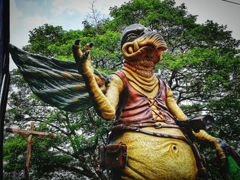Low angle view of statue against sky