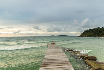 Pier over sea against sky