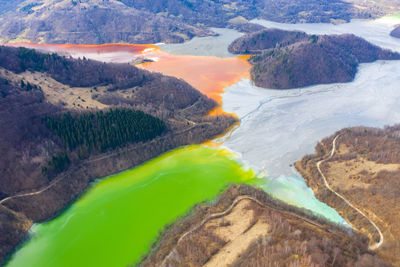 Aerial view of chemical residuals flooded natural environment, ecological bomb