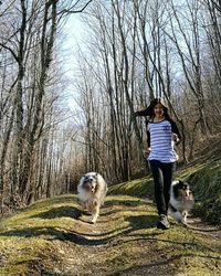 Full length of man with dog against sky