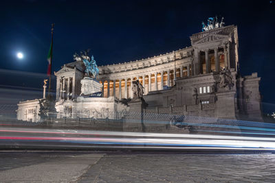 Light trails on city street at night