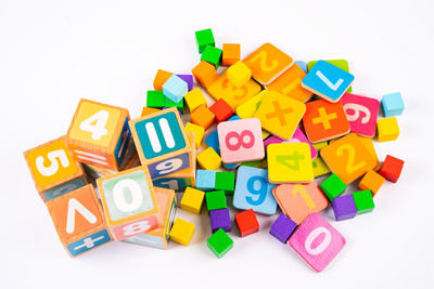 Close-up of multi colored toy blocks against white background