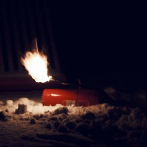 Close-up of fire burning at night