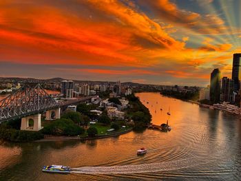 High angle view of buildings against cloudy sky during sunset