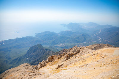 Scenic view of mountains against blue sky