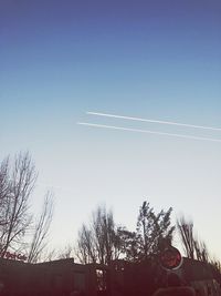 Low angle view of vapor trail against clear sky