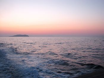 Scenic view of sea against clear sky during sunset