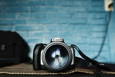 Close-up of camera on table