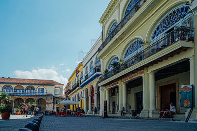 People in front of historic building