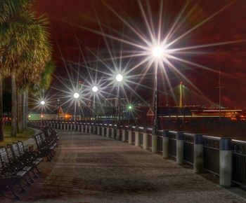 Illuminated bridge at night