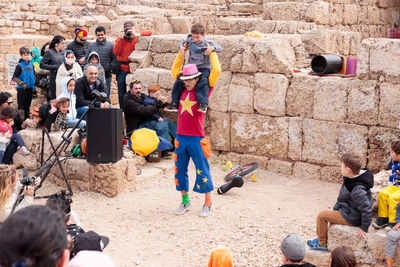 People photographing on sand