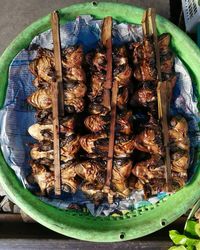 High angle view of meat on barbecue grill