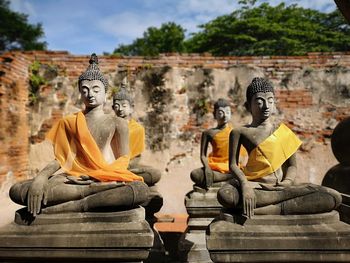 Buddha statue against temple