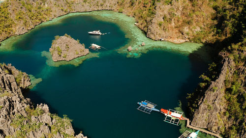 Lagoons and coves with blue water among the rocks. lagoon, kayangan covered with forests