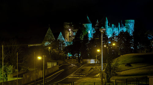 Illuminated buildings in city at night