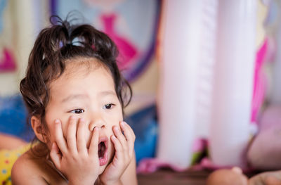 Close-up of cute girl at home