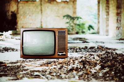 Old television set in abandoned house
