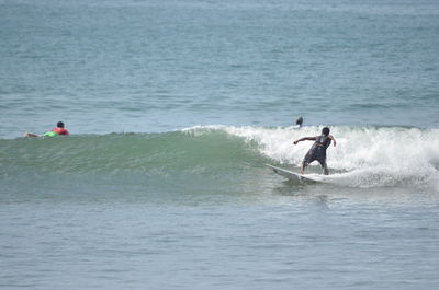 Men enjoying in sea