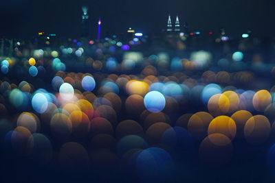 Defocused image of illuminated lights at night