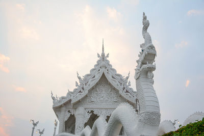 Low angle view of temple against building