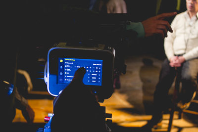 Rear view of man photographing