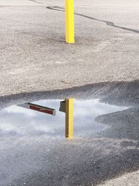 Yellow umbrella on street