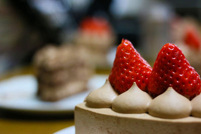 Close-up of served chocolate cake with strawberries