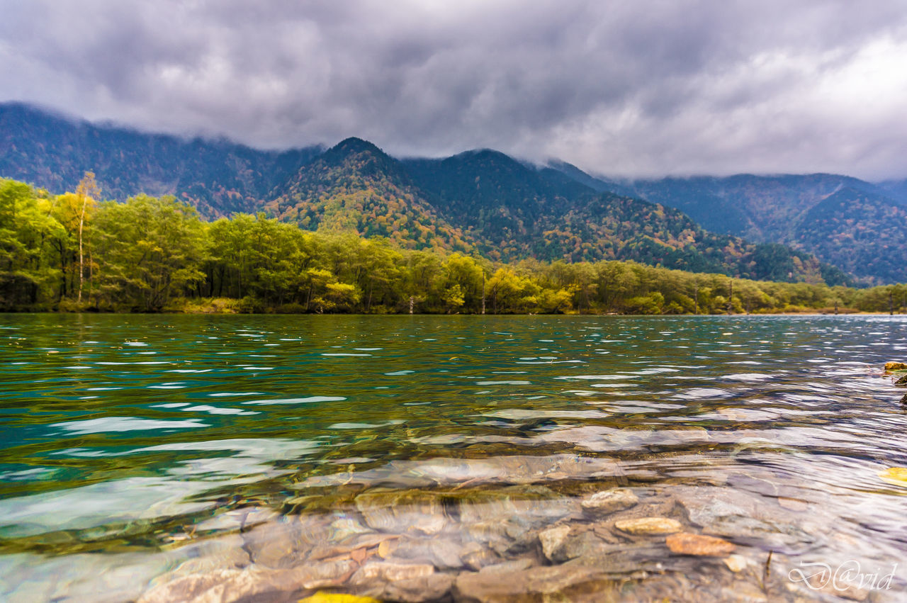 SCENIC VIEW OF LAKE WITH MOUNTAINS IN BACKGROUND