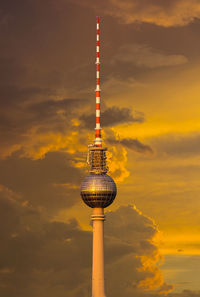 Low angle view of communications tower against sky