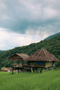 Built structure on field against sky