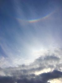 Low angle view of rainbow in sky