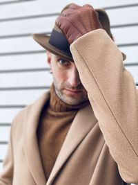 A man in a hat and coat.  gentleman portrait 