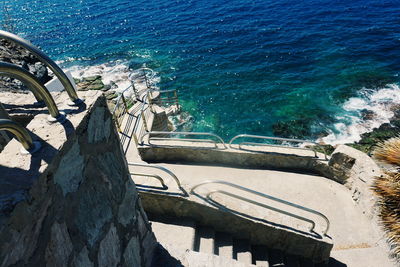 High angle view of sea by trees