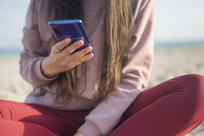 Young woman using mobile phone