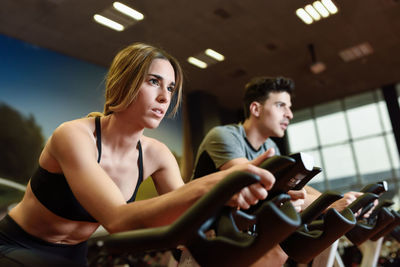 Friends exercising at gym